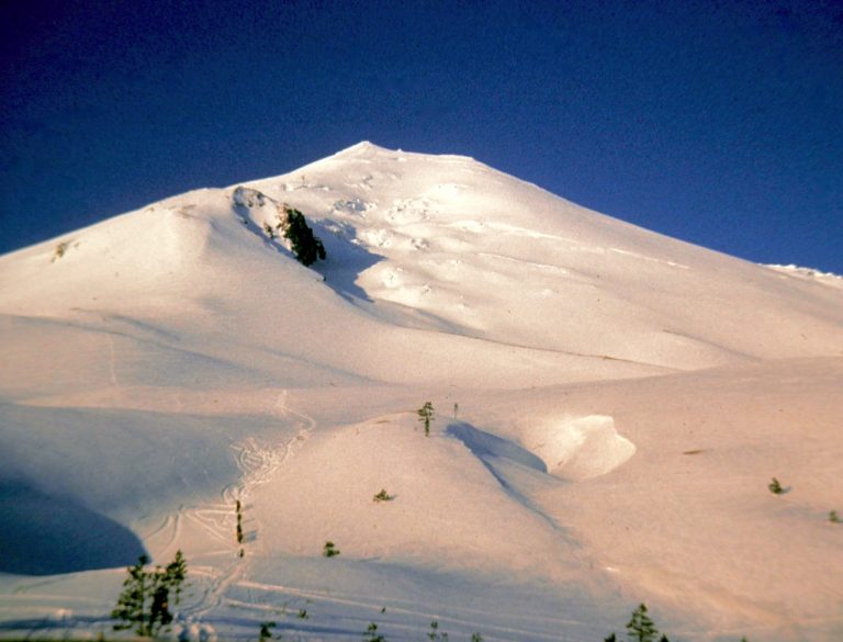 Morning sun warms the snowy cone of Mt St Helens before it erupted in 1980