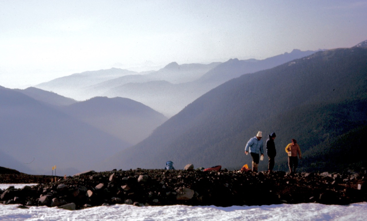 Mountain climbers set up camp on Heliotrope Ridge below summit of Mt Baker in the North Cascades