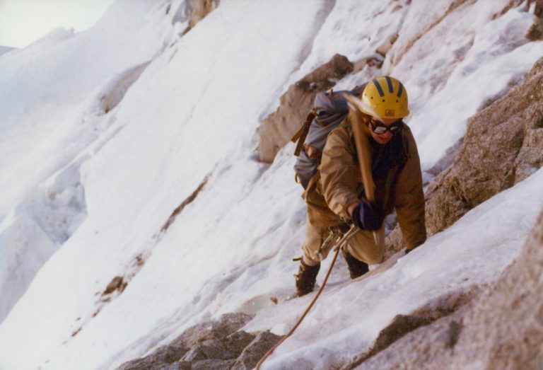 A roped mountain climber crampons up a steep couloir above the Ice Cliff Glacier on Mt Stuart in the Icicle Mountains