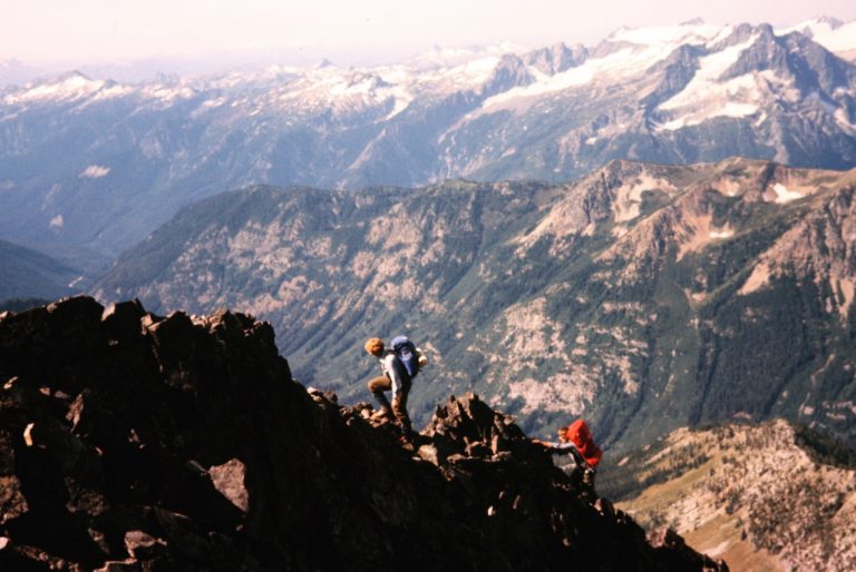 Mountain climbers scrambling up the rocky northwest ridge on Seven-Fingered Jack in the Entiat Mountains