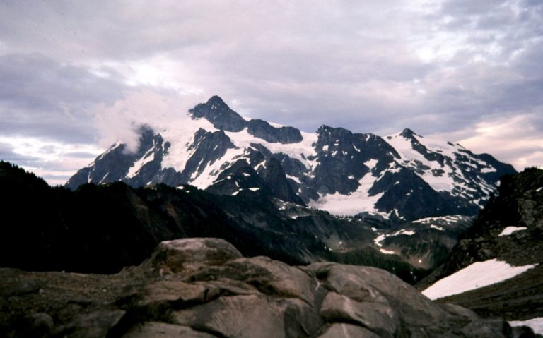 Mt Shuksan stands under a cloudy sky viewed from Artist Point in North Cascades National Park