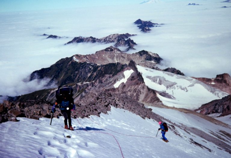 mountain climbers on Frostbite Ridge with exposed scree heading up to the summit of Glacier Peak