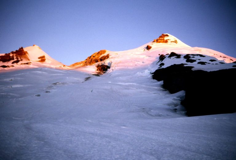 Morning sun warms the summit of Mt Baker in the Washington Cascades