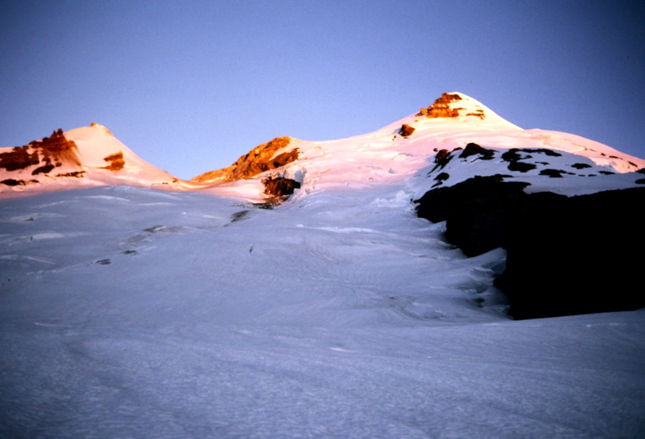 Morning sun warms the summit of Mt Baker in the Washington Cascades