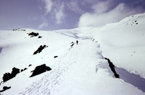 Mountain climbers ascend a snowy ridge on Mt Saint Helens