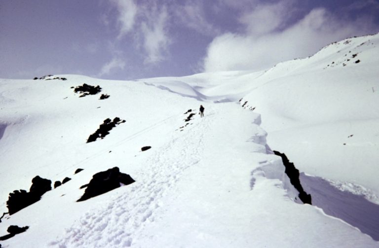 Mountain climbers ascend a snowy ridge on Mt Saint Helens