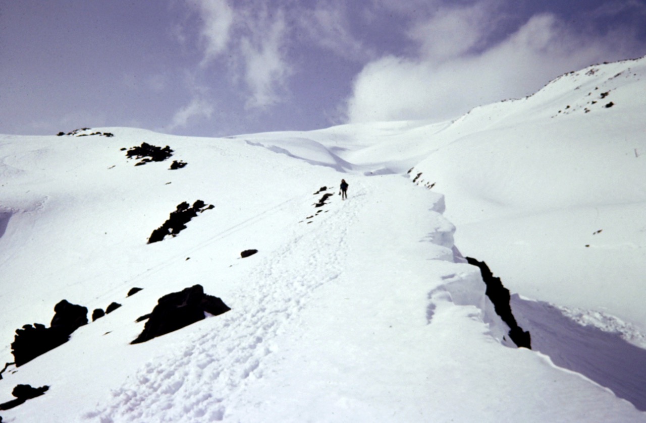 Mountain climbers ascend a snowy ridge on Mt Saint Helens