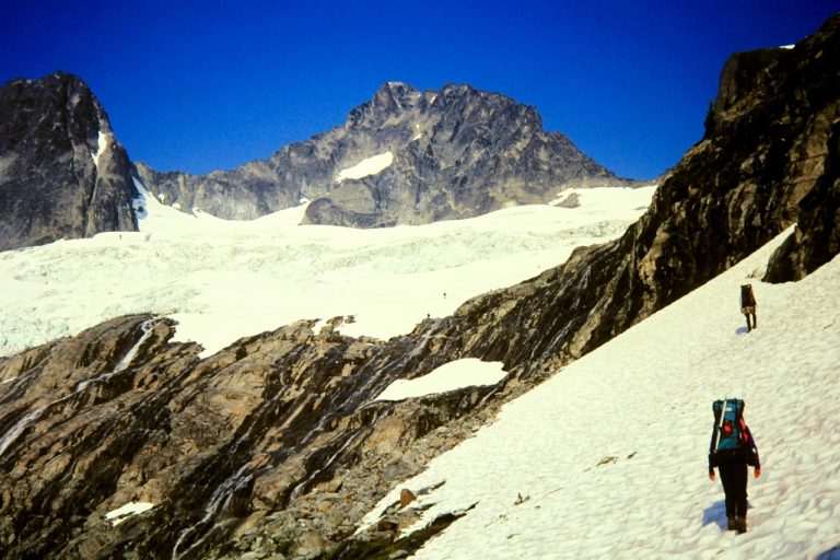 Mountain climbers crossing a snowfield above Holden Pass en route to Bonanza Peak summit