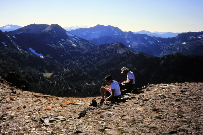 Hikers stop for a rest at Augusta Pass while traversing Icicle Ridge