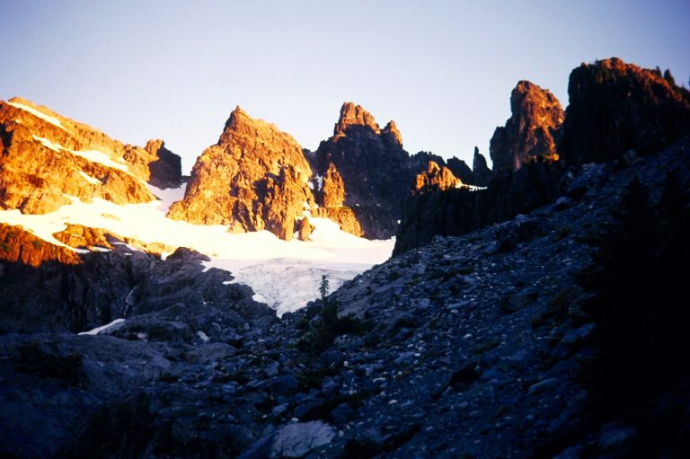 Golden morning sun lights up the huge face of Chimney Rock