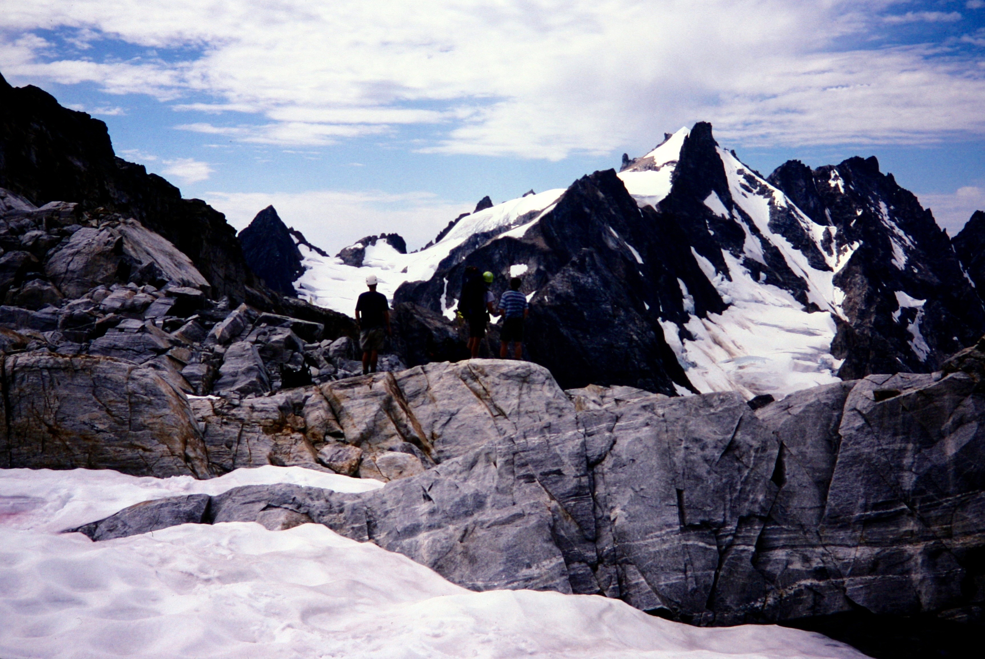 The East Peak of Mt Fury rises above a black cliff and steep glacier as seen from Luna Pass in the Picket Range