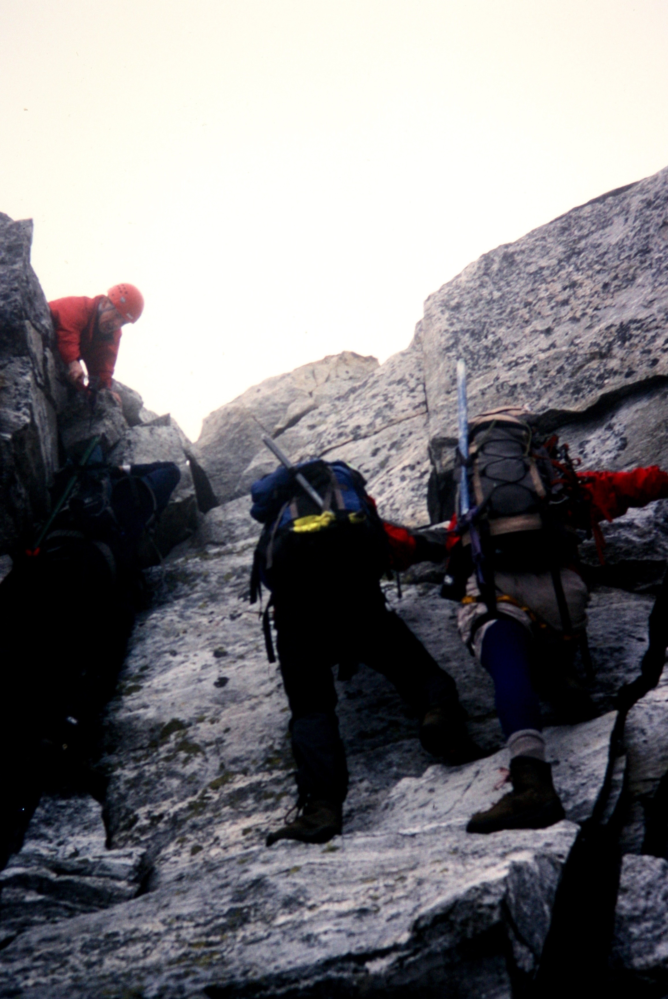 mountain climbers scrambling steep rock on the Mt Fury ridge line
