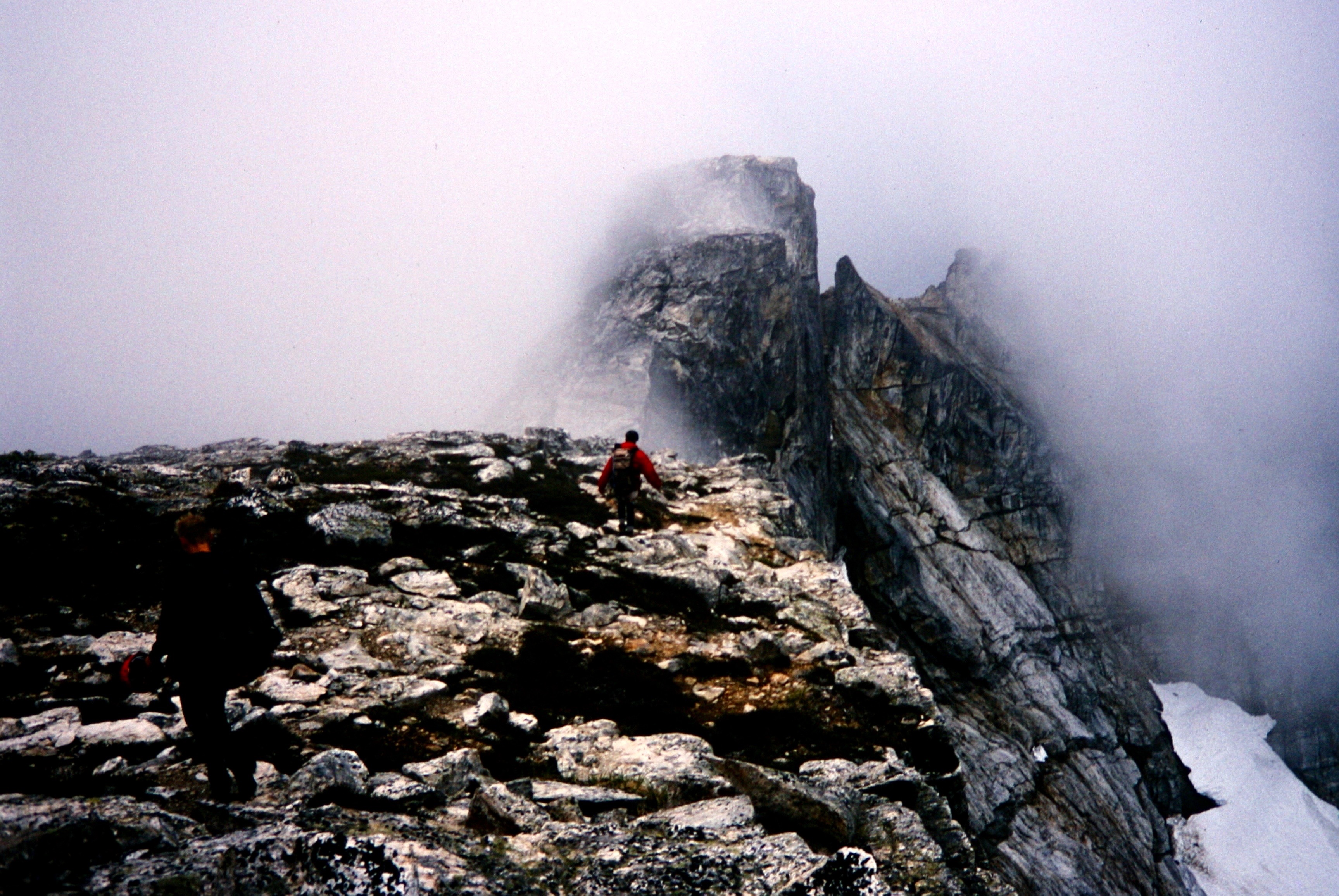 mountain climbers scrambling the rock on Mt Fury ridge in the Northern Pickets