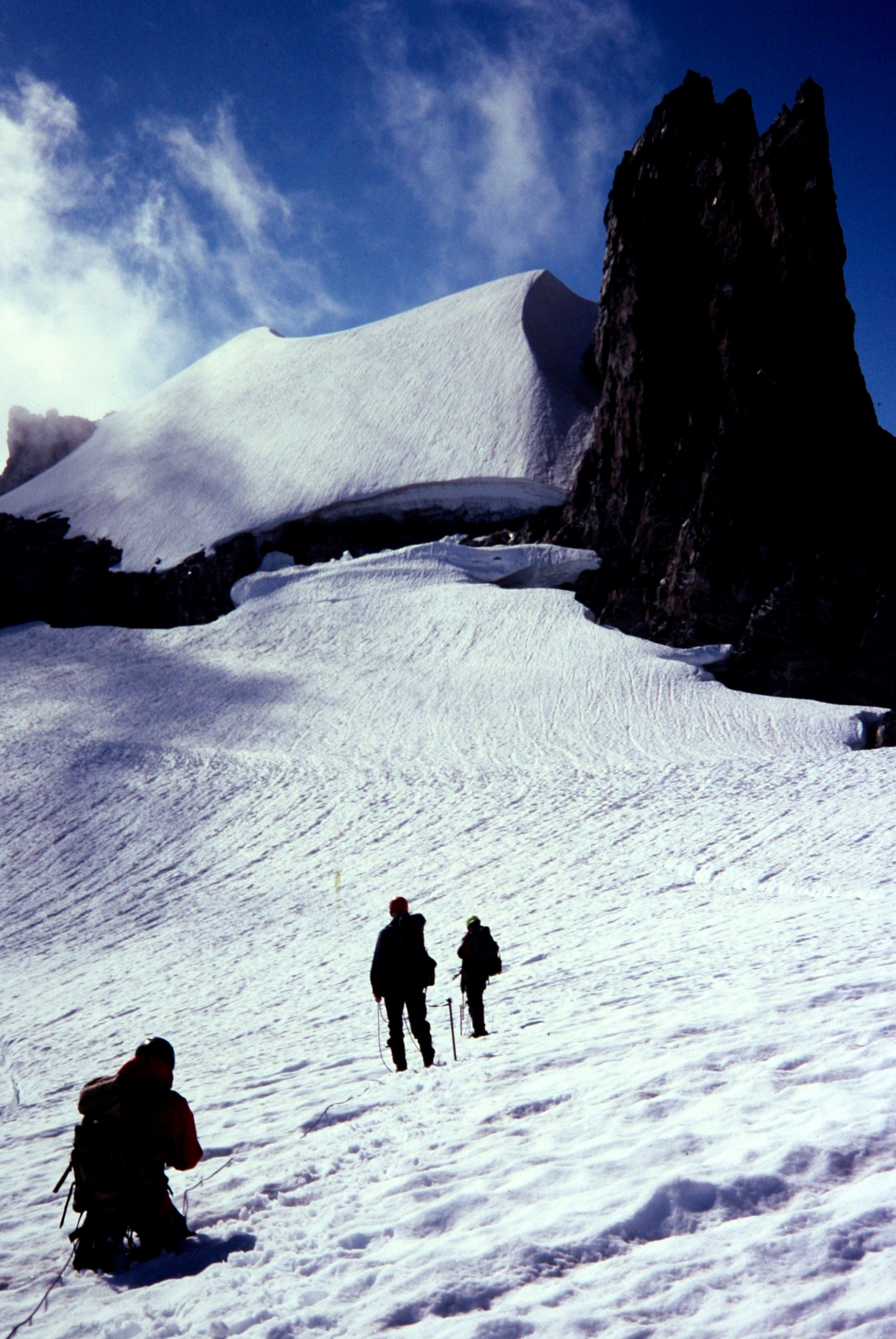 mountain climbers assessing a giant bergschrund on the Fury Glacier in the Northern Picket Range