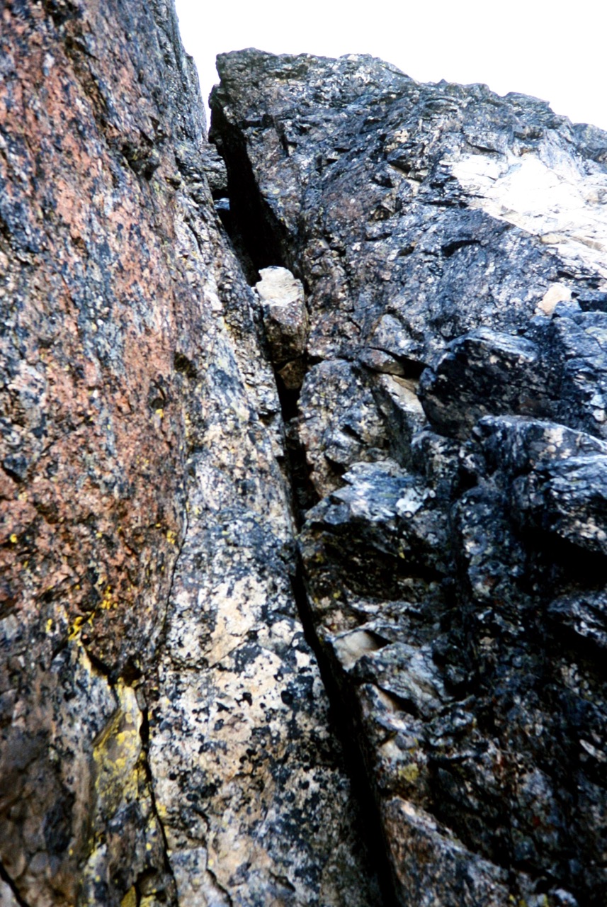 crux chimney on the steep, rocky summit horn of Bears Breast Mountain in the Alpine Lakes Wilderness