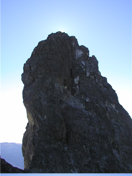 scary, rock summit horn of Bears Breast Mountain against blue skies in the Alpine Lakes Wilderness
