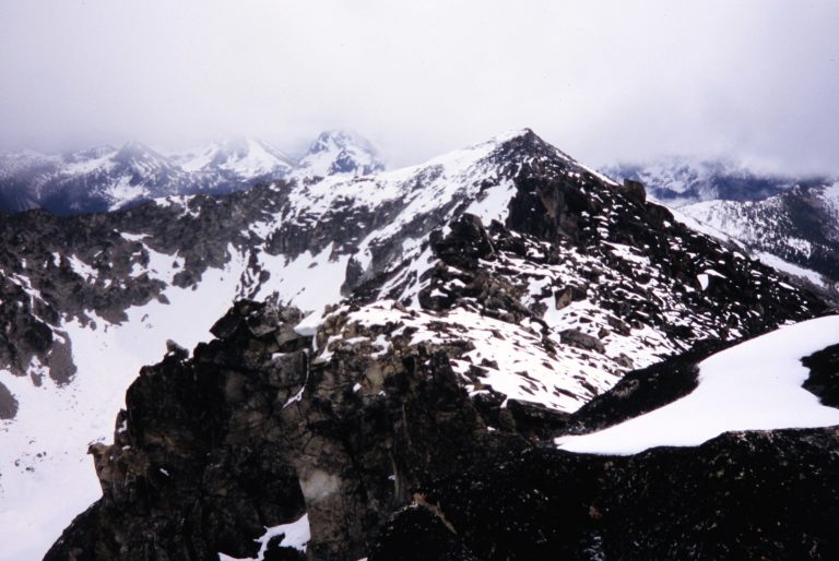 Looking along Raven Ridge at pyramidal Corax Peak in the Sawtooth Mountains