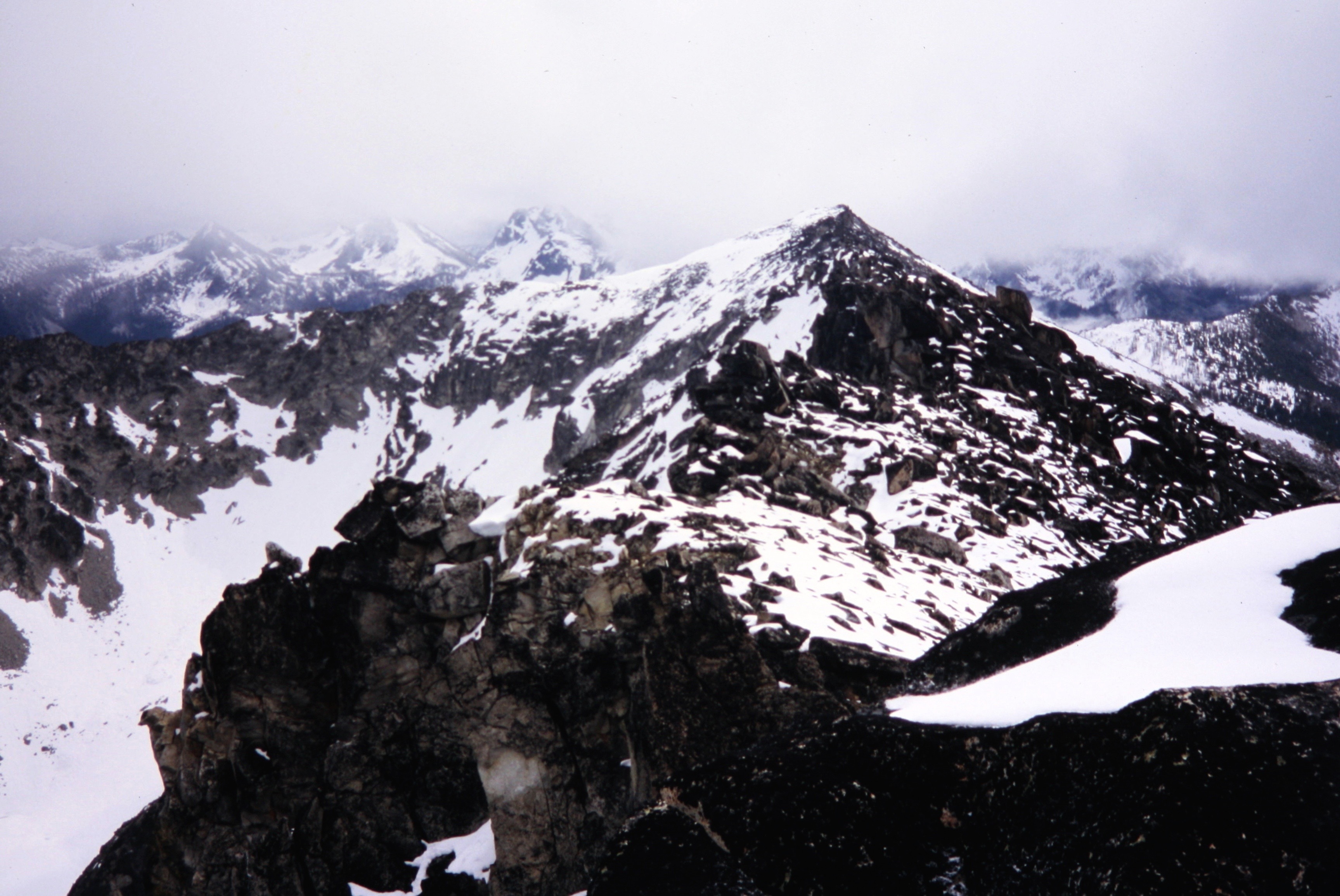 Looking along Raven Ridge at pyramidal Corax Peak in the Sawtooth Mountains