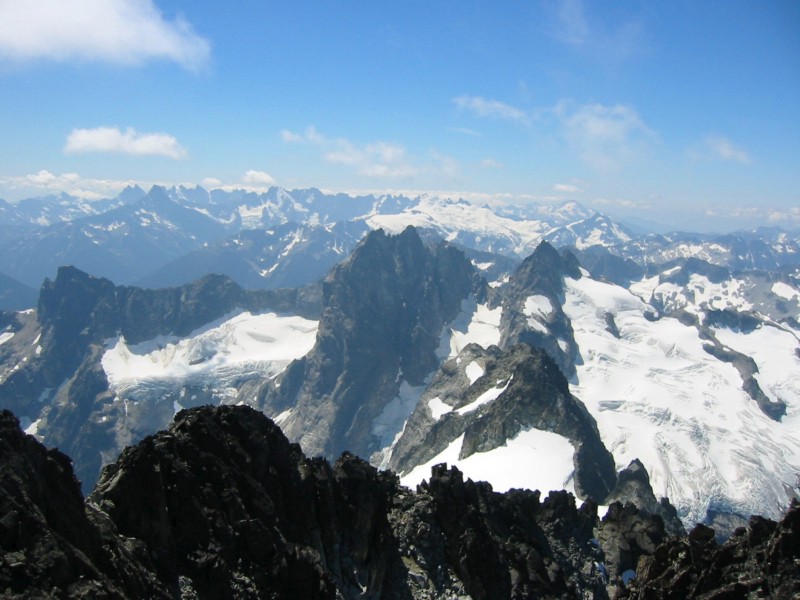 Mox Peaks in front of the Northern Picket Range as seen from Mt Spickard in the American Chilliwack Mountains