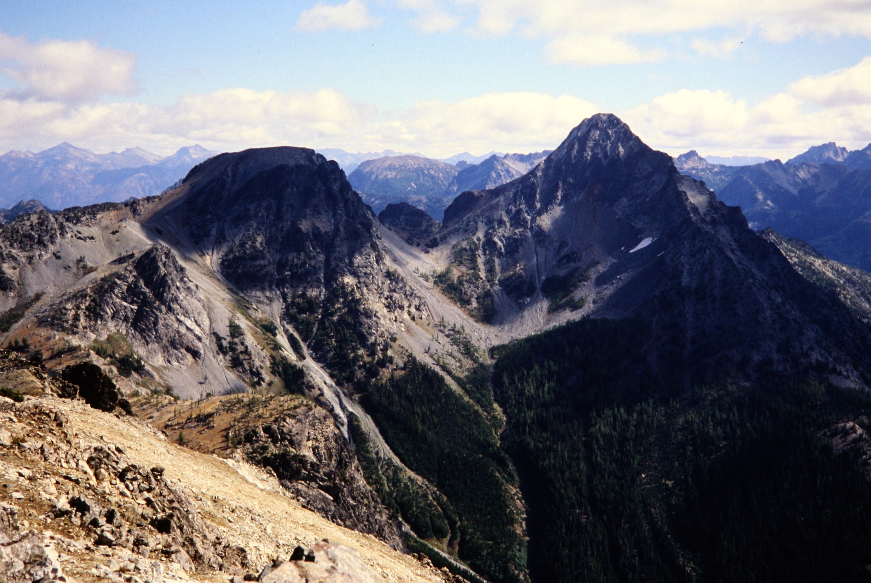 North and South Spectacle Butte standing across a valley with fall golden colors in the Entiat Mountains
