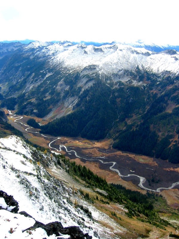 looking down on the Napeequa Valley with the snow covered Chiwawa Mountains as seen from the summit of Little Giant Peak in the Glacier Peak WIlderness