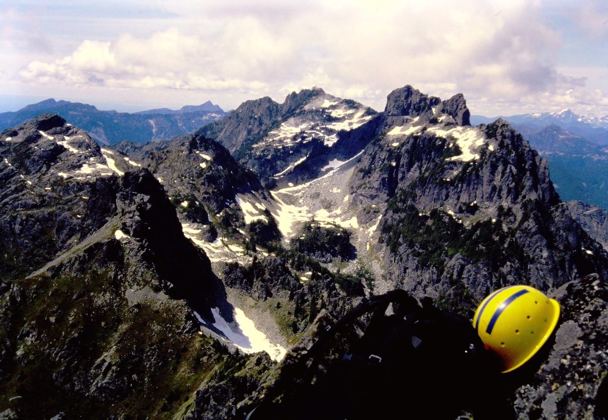The rocky summit of Gunn Peak dominates the horizon from Merchant Peak