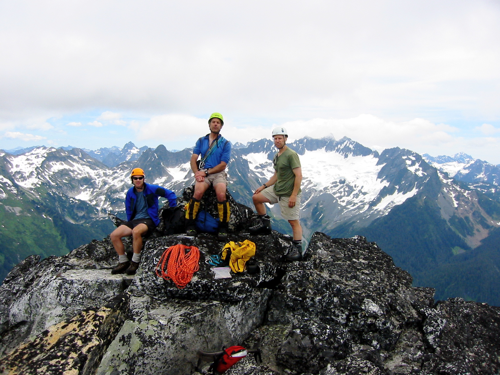 mountain climbers taking a break on the rocky summit of Mt Bruseth