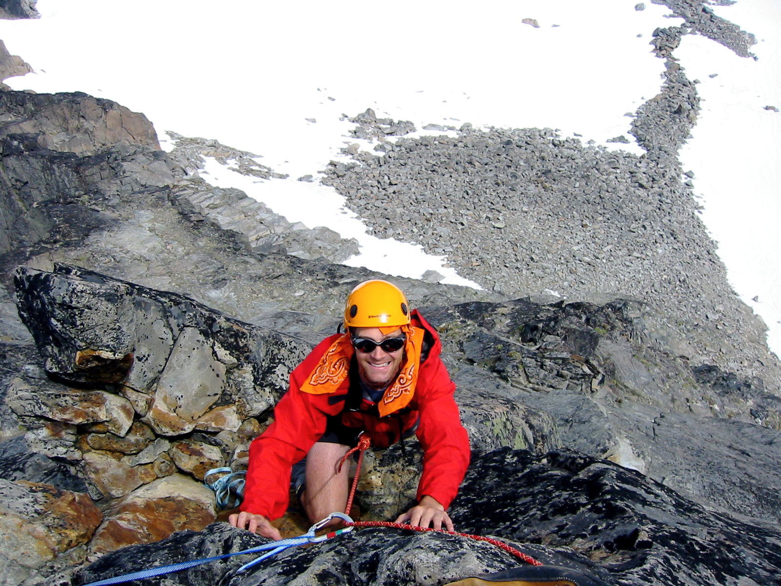 mountain climber on the rocky summit of Spire Point in the Glacier Peak Wilderness