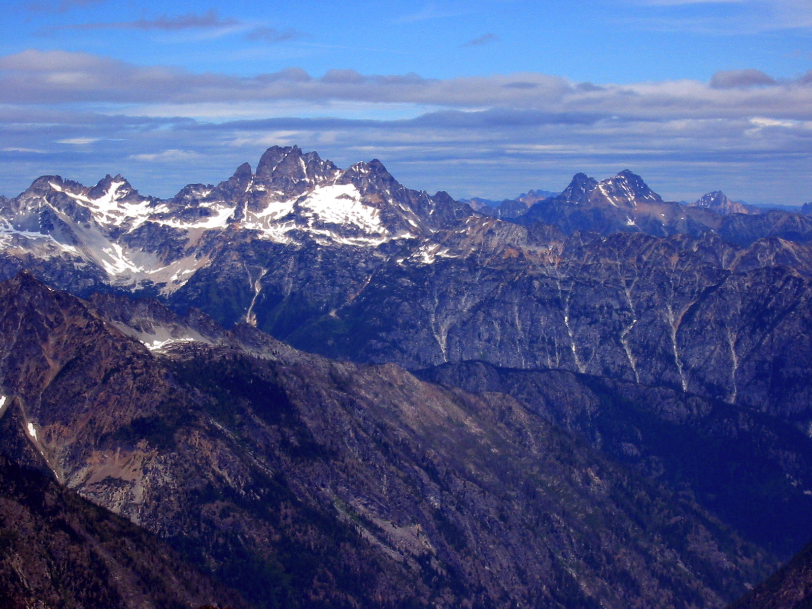Mt Logan, Mt Goode, and Black Peak mountains fill the skyline