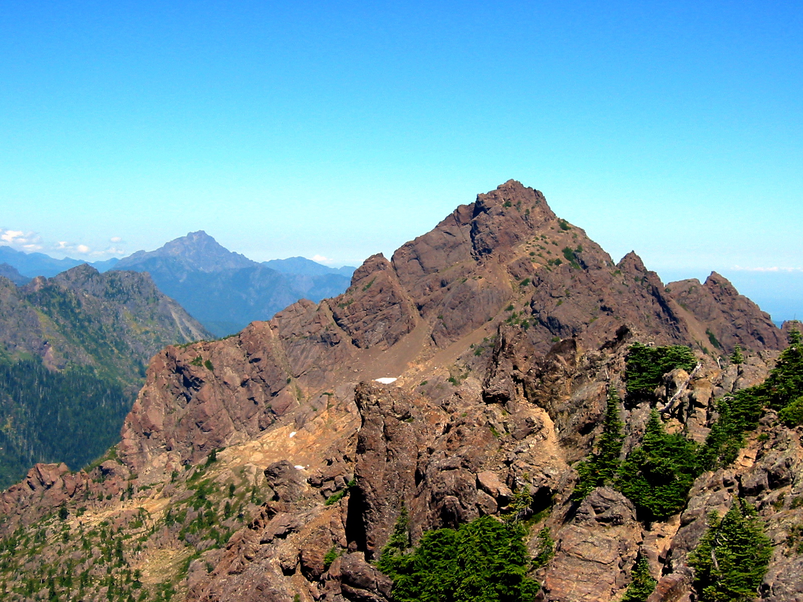 The rocky summit of Mt Washington stands at the end of a rugged ridge