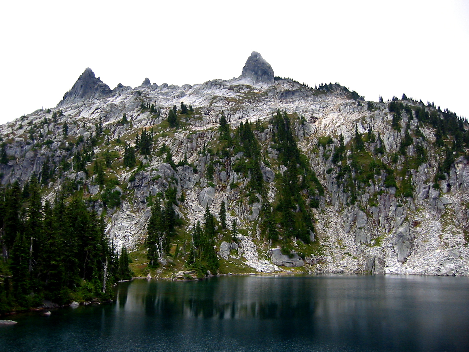 The Bulls Tooth forms a sharp rock horn atop a granitic ridge above Doelle Lake