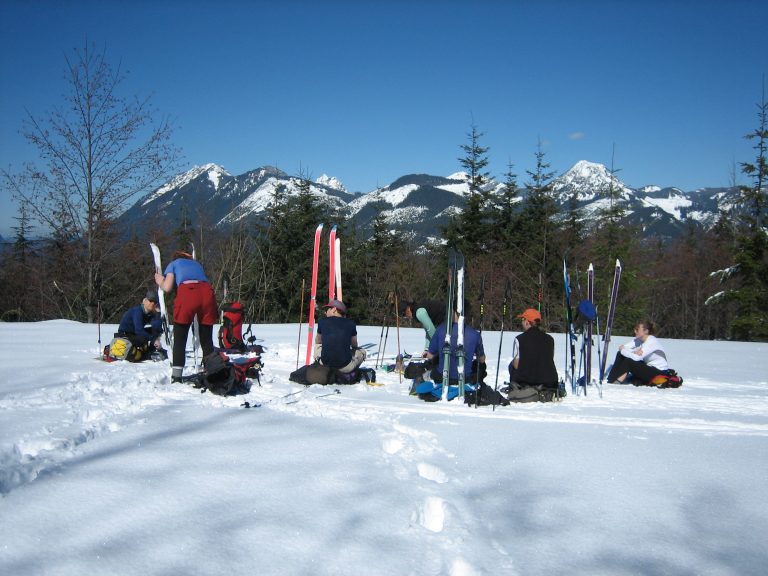 A group of backcountry skiers stops for snacks on Sobieski Mountain