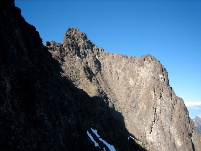 Hozomeen Mountain south peak stands against a dark blue sky