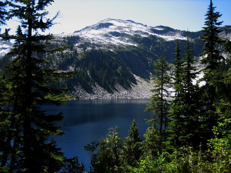 Camp Robber Peak stands above Big Heart Lake during the Big Heart Summit Loop