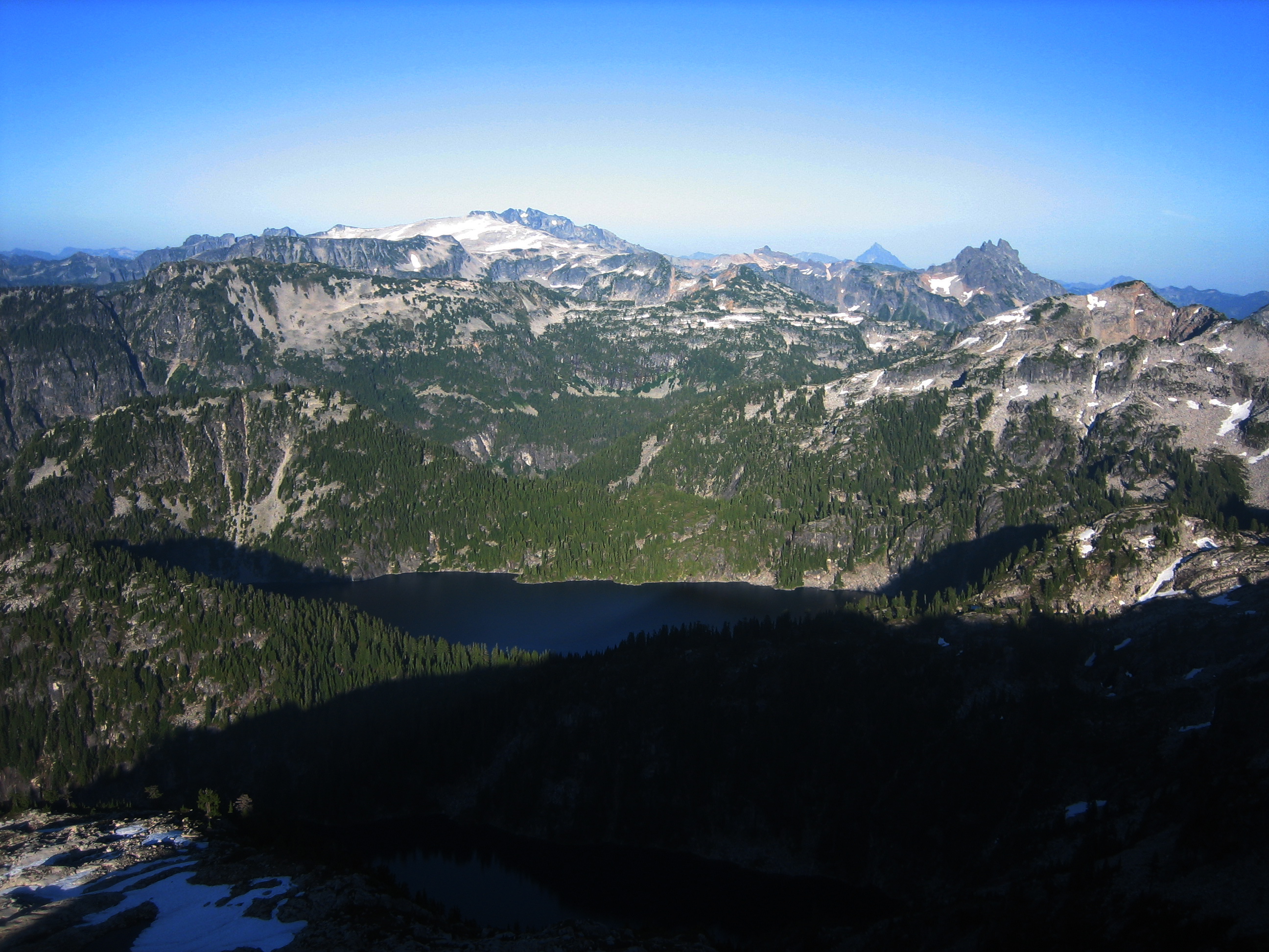 Mt Hinman and Bears Breast Mountain Above Angeline Lake with evergreen forests and rocky cliffs