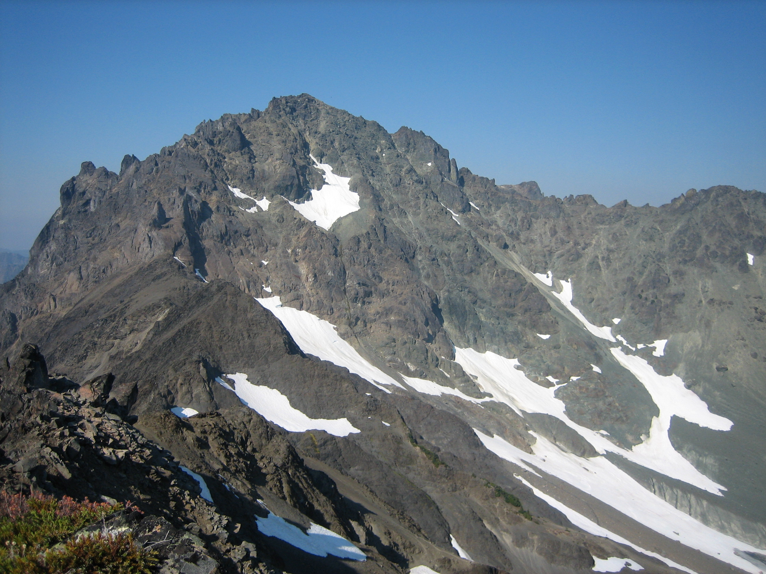 Mt Deception with snow patches as seen from Royal Peak in the Olympic Mountains