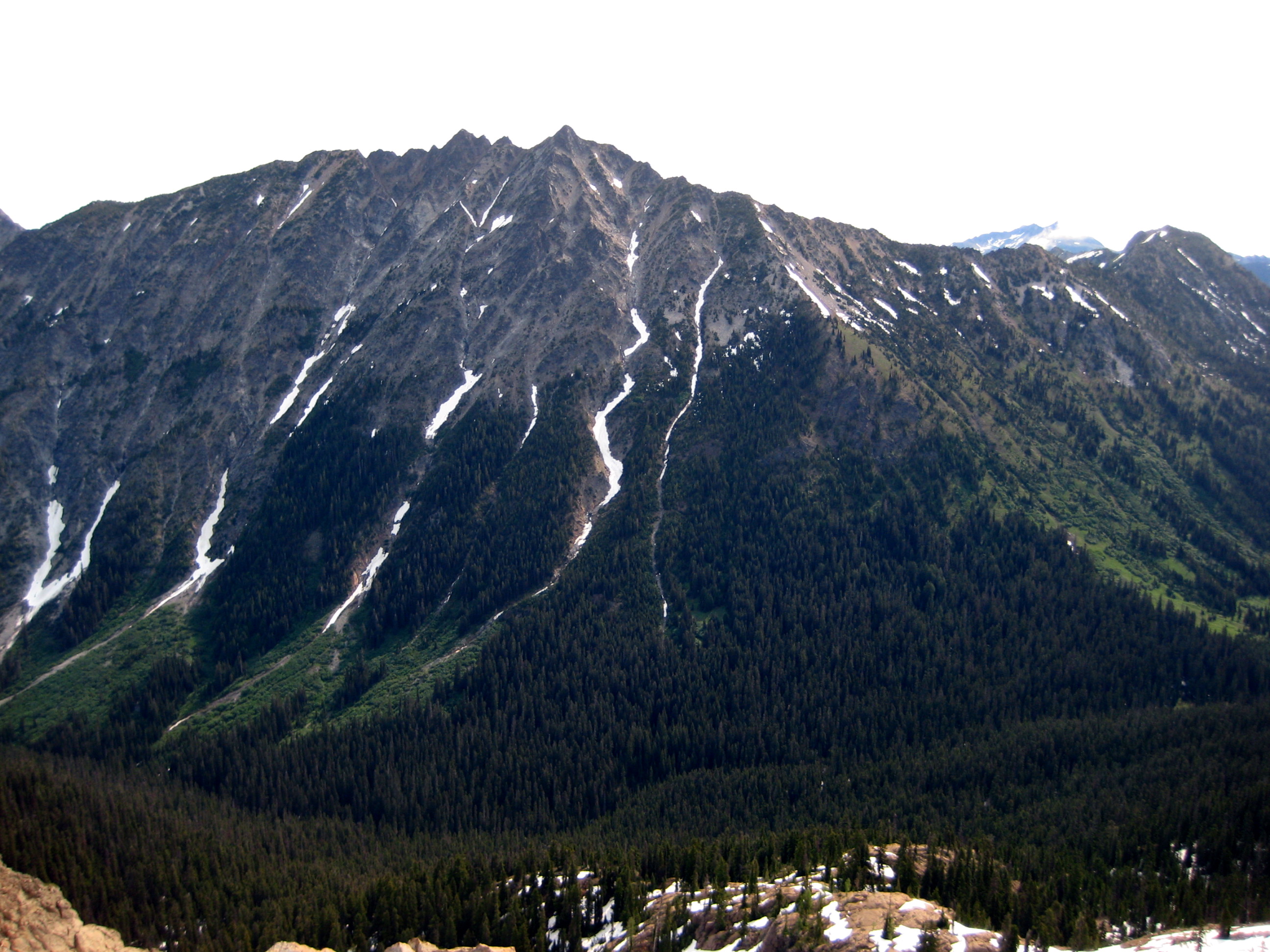 The double-summited mountain crown of The Cradle standing over a deep valley