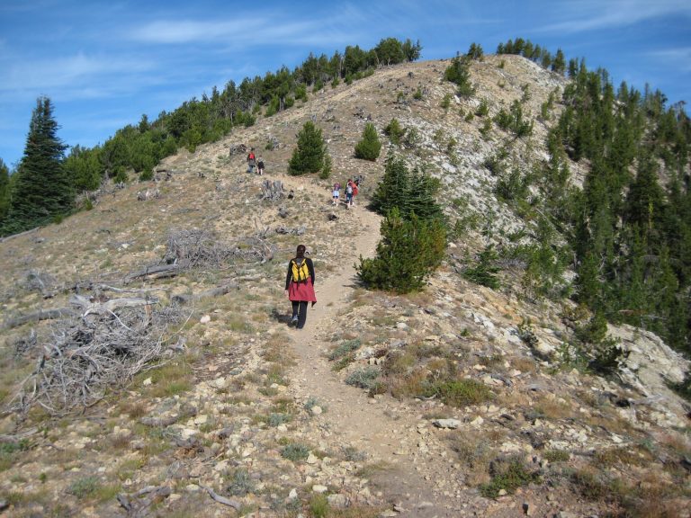 Hikers follow a trail up Stormy Mountain