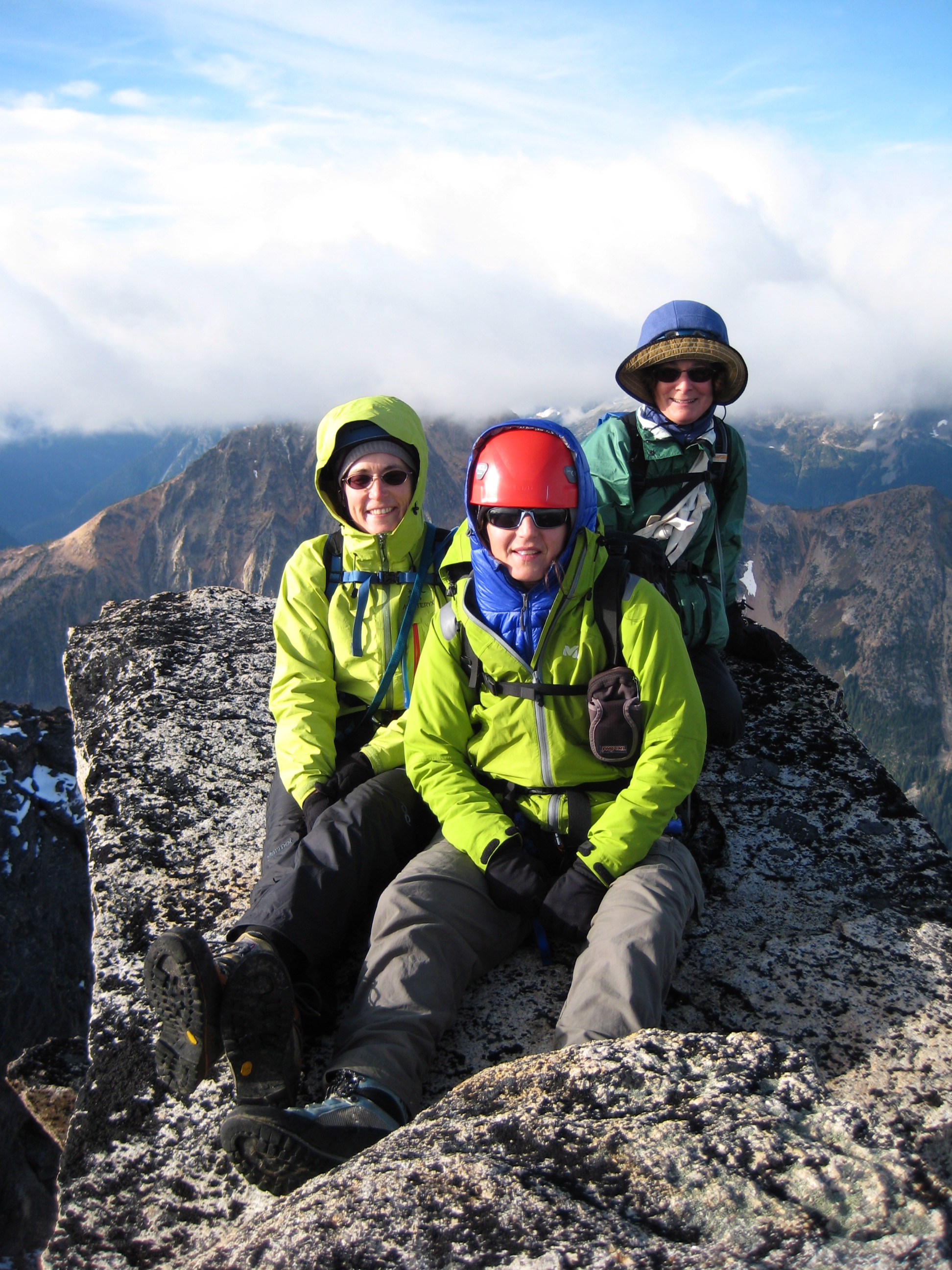 mountain climbers sitting on the granite slab of Golden Horn peak in the Upper Methow Mountains