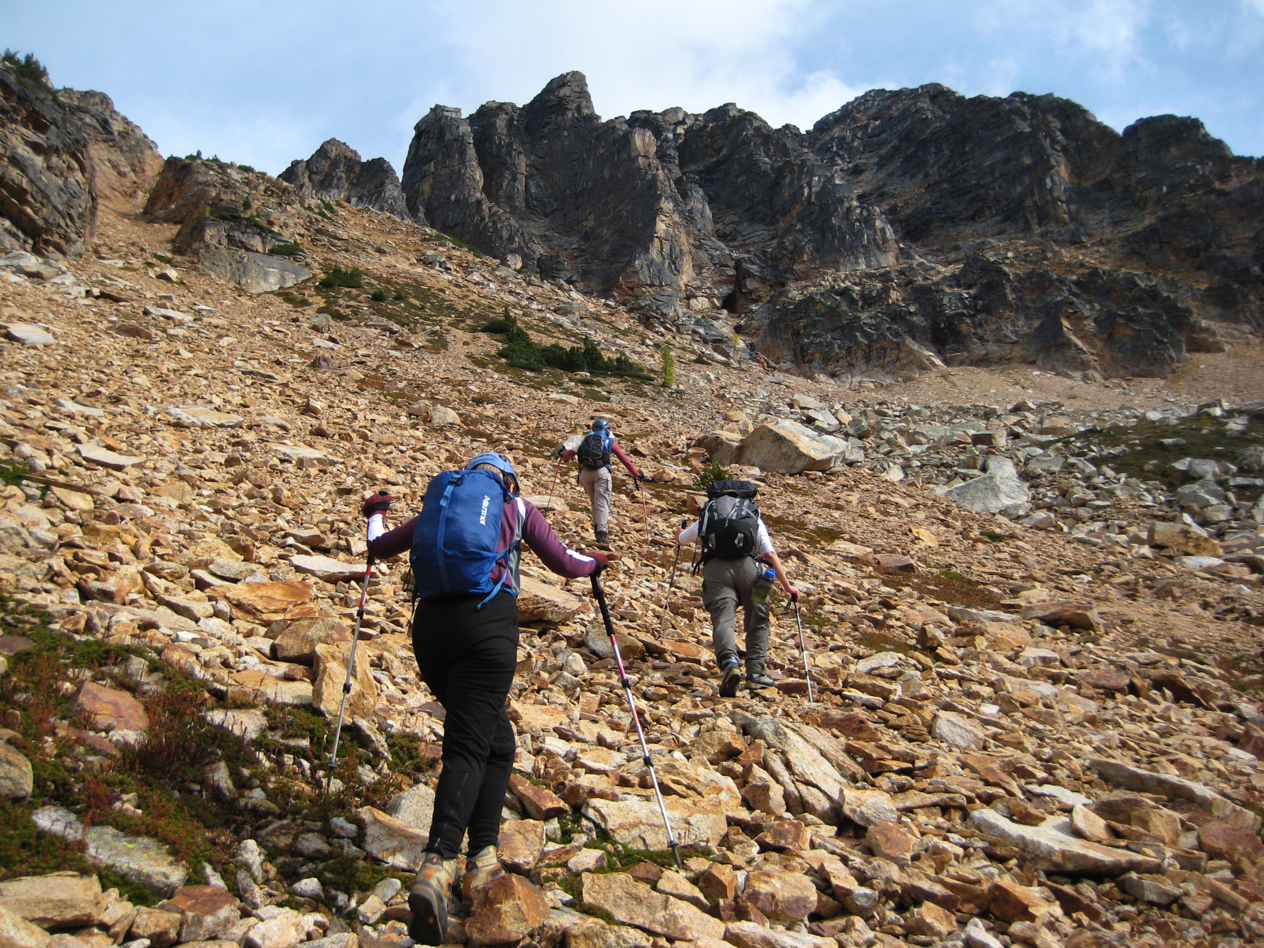 mountain climbers traversing loose scree slope below Tower Mountain in the Upper Methow Mountains