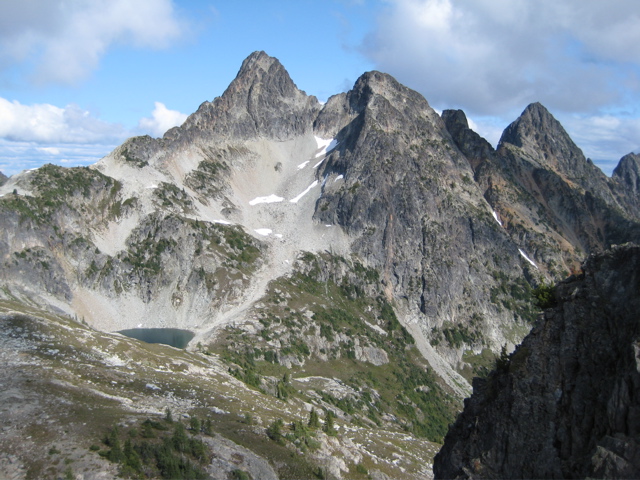 The rocky summit horn of Fisher Peak stands high above Silent Lakes in North Cascades National Park
