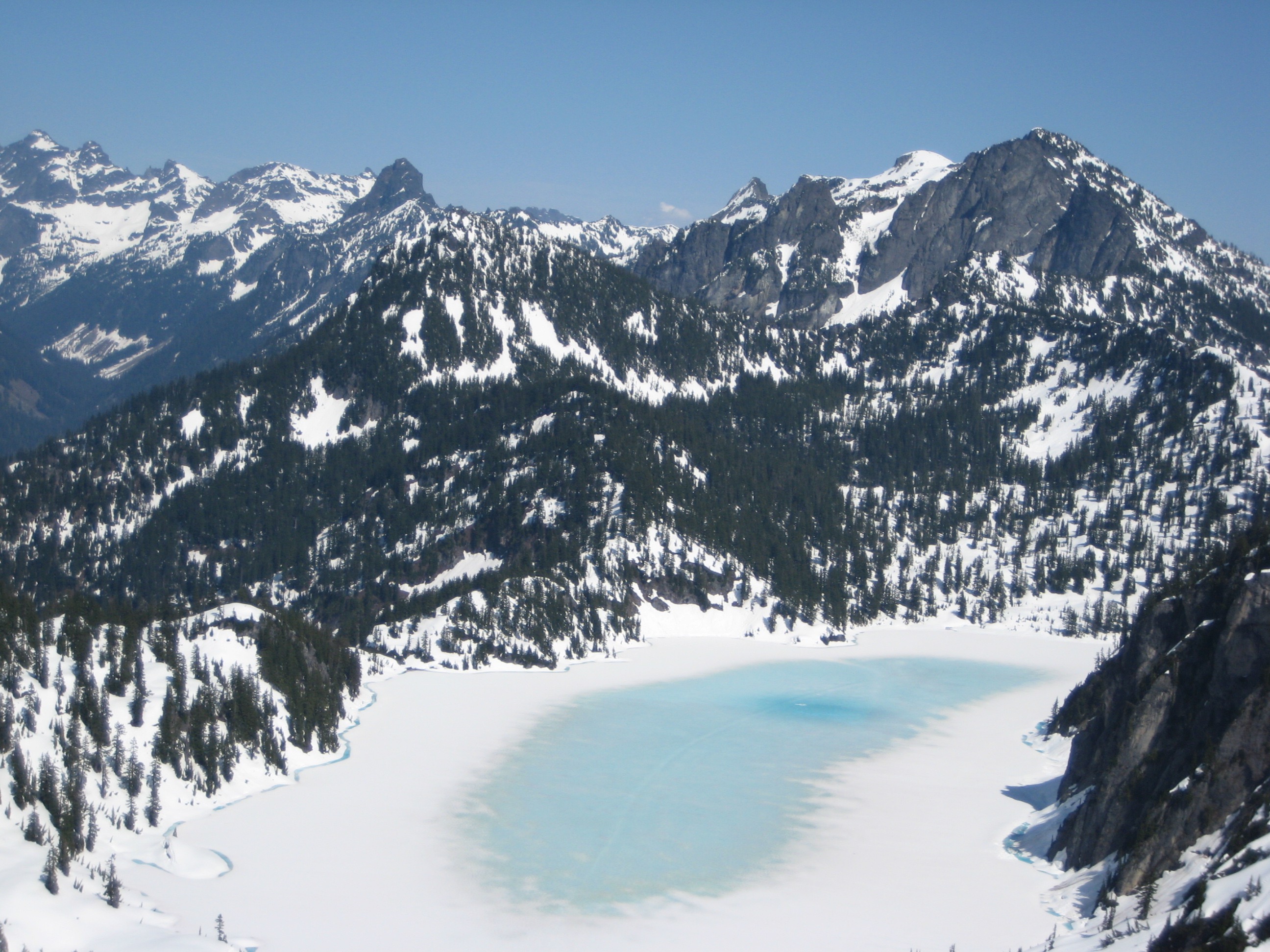 Snow Lake starting to melt out with the Snoqualmie Mountains in the background