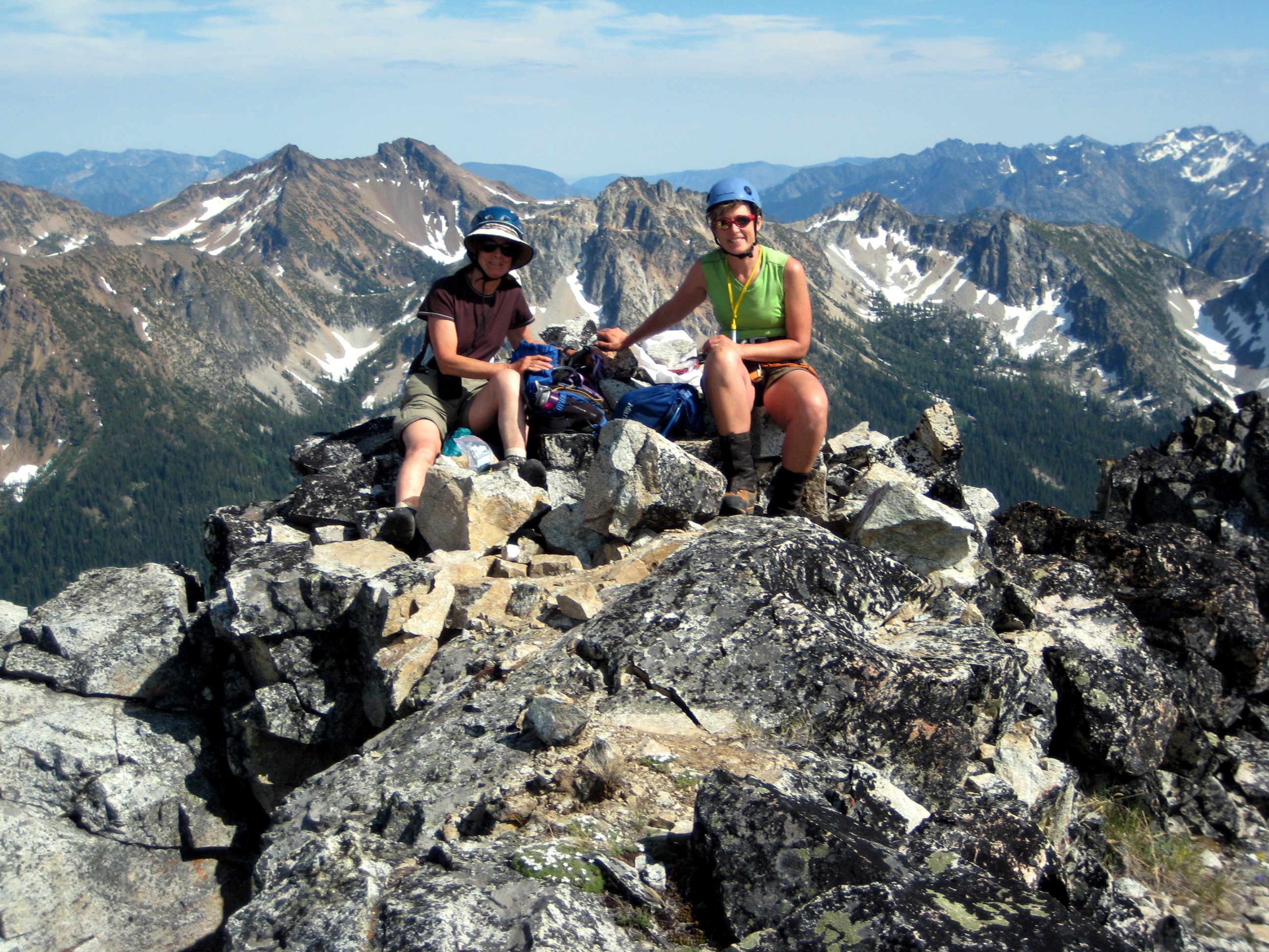 mountain climbers taking a break in the large summit boulder field on Devore Peak in the Stehekin Mountains