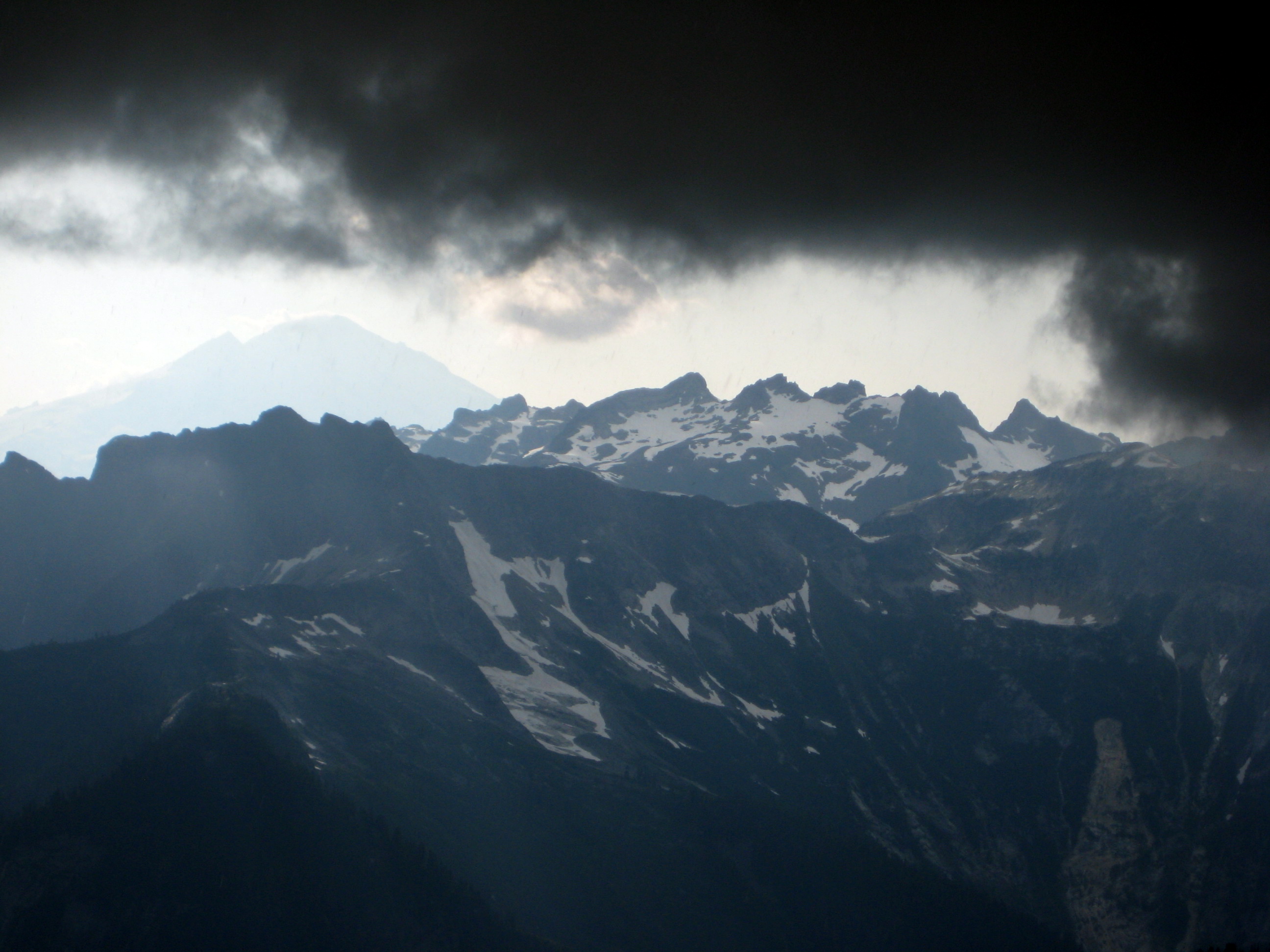 Dark, black storm clouds over Mt Hagan in the North Cascades