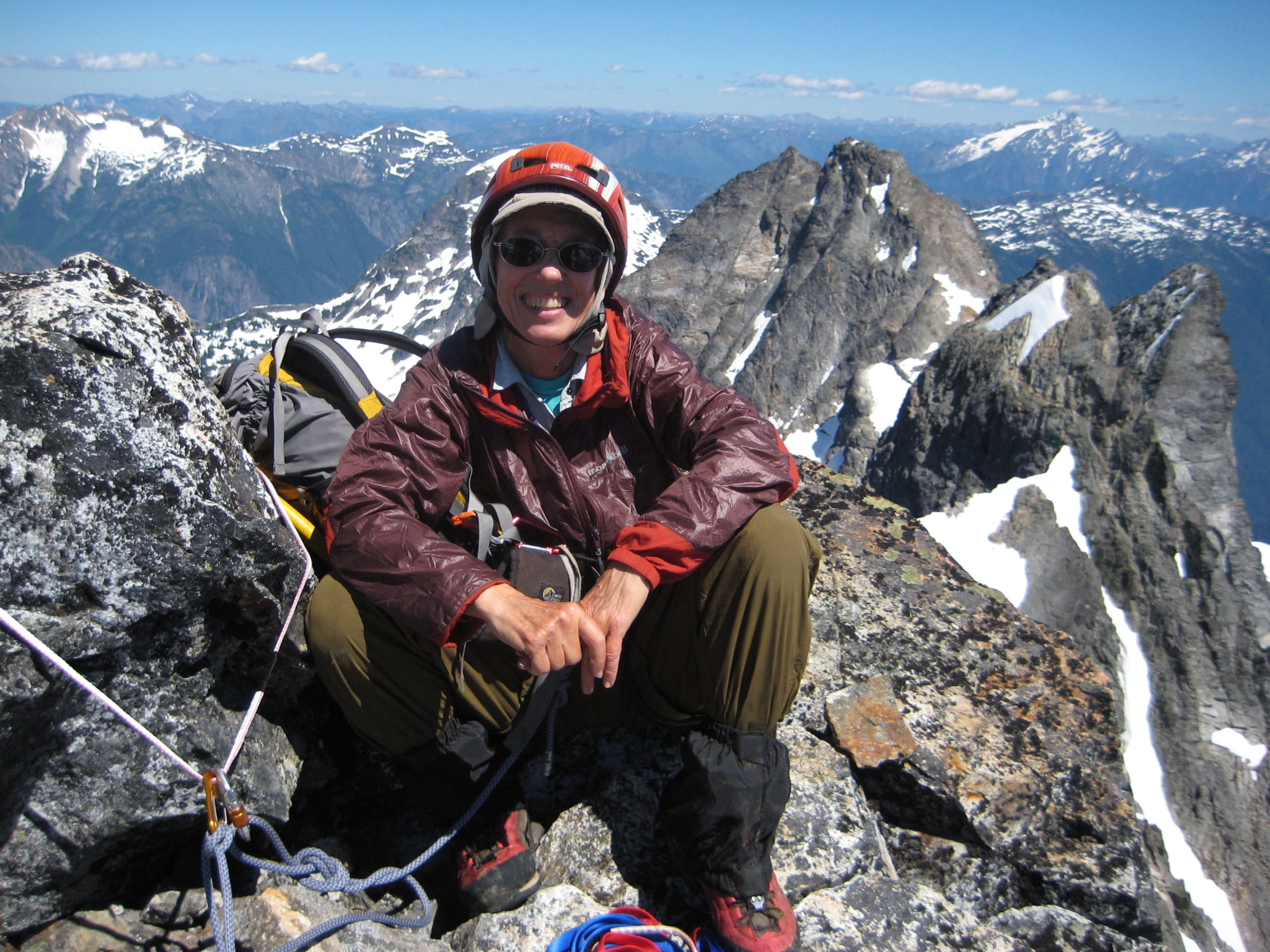 Roped mountain climber on the rocky summit of Mt Degenhardt in the Southern Picket Range