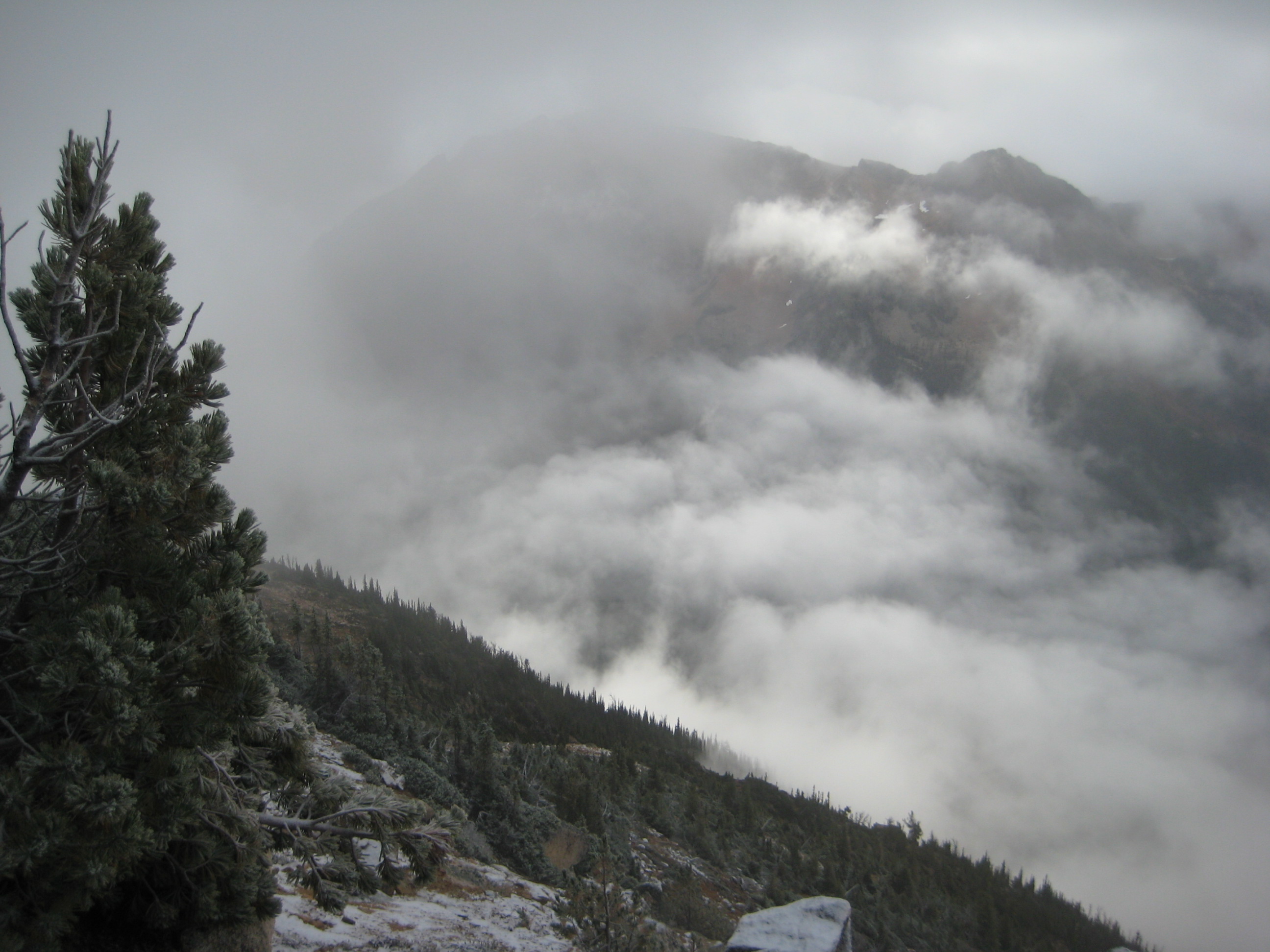 heavy clouds and fog hang over Methow Pass as Seen from Mt Hardy in the Upper Methow Mountains