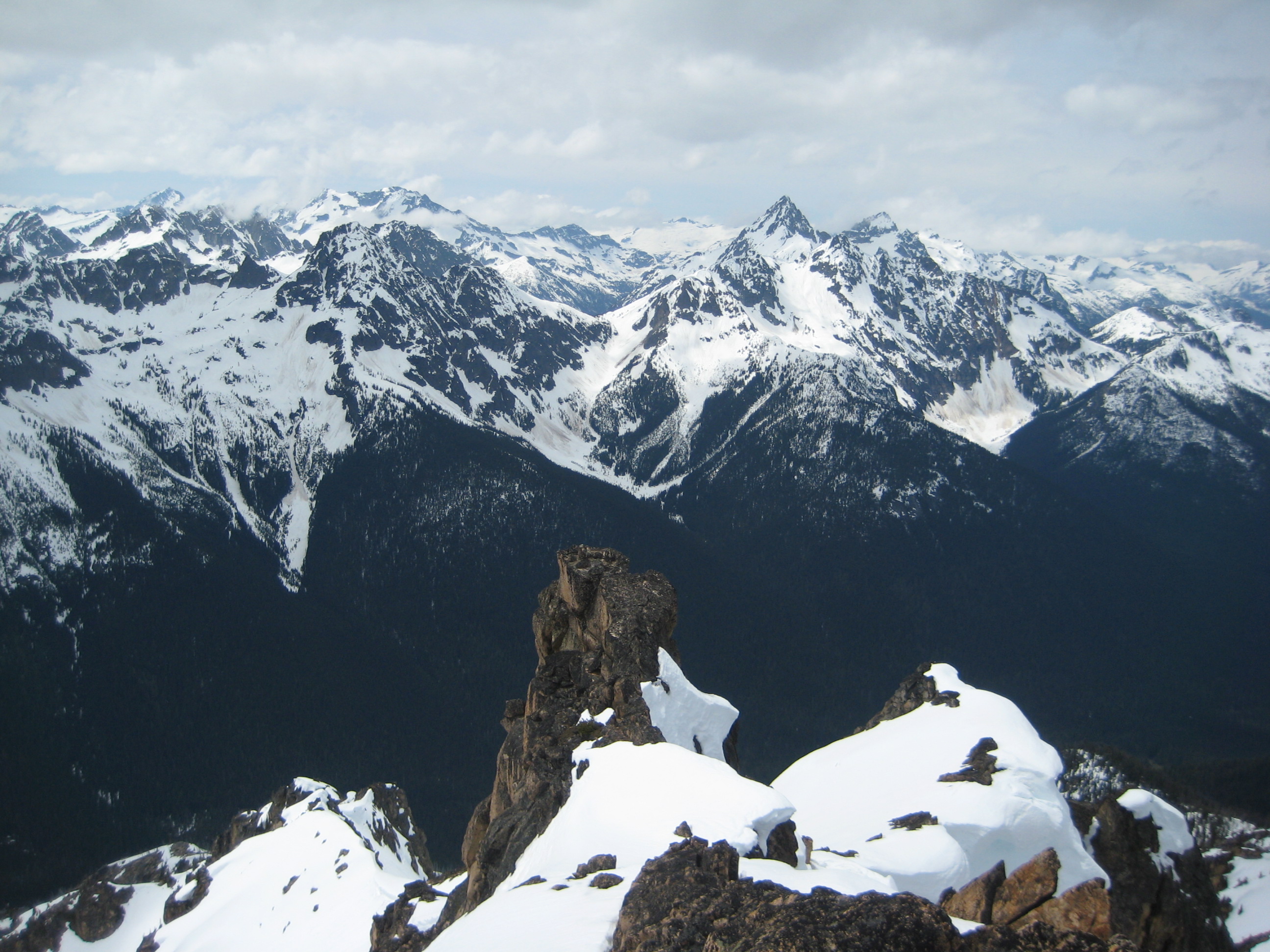 Looking over a vast sea of rugged mountains that make up Ragged Ridge as seen from the summit of Mt Hardy in the Upper Methow Mountains