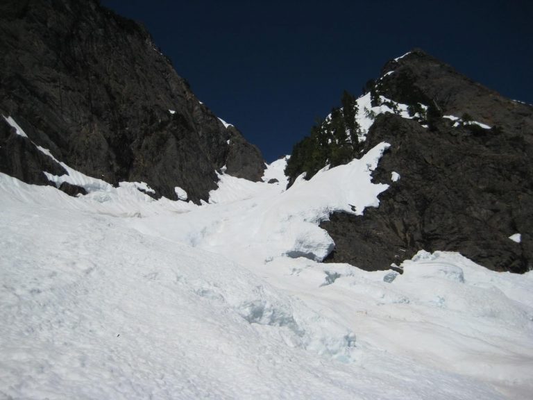 A steep snow chute sweeps upward to Big Four Mountain