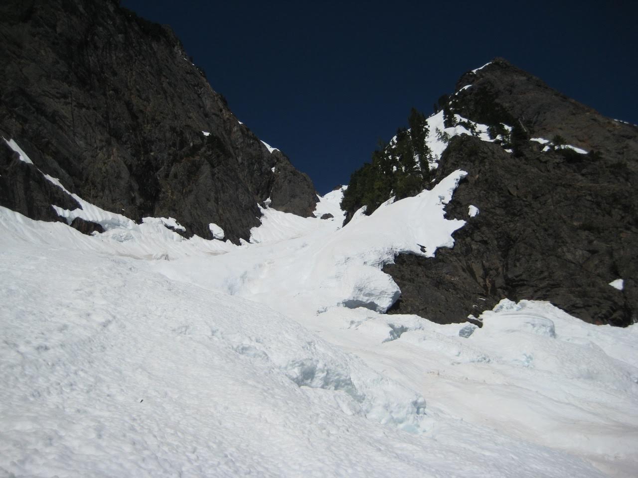 A steep snow chute sweeps upward to Big Four Mountain