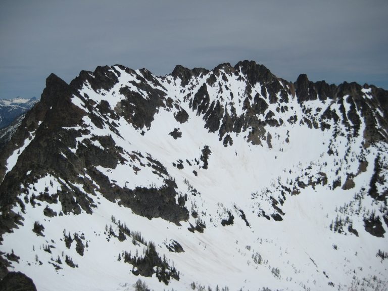 Broad craggy Wy'East Mountain stands above a snow bowl